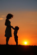 © Pavel Losevsky - Mother and daughter on sunset silhouette