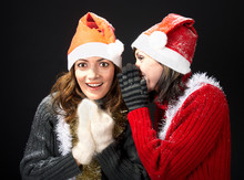 Girls In Santa's Caps Gossiping
