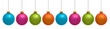Blue, pink and green colorful Christmas ornaments on white