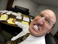 Mean Looking Man In Business Office Gritting Teeth