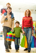 © pressmaster - Modern family going shopping in trade center