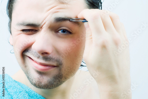 Young Men Pluck His Eyebrows Buy This Stock Photo And Explore