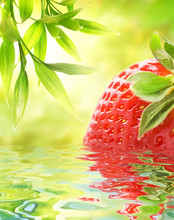 Ripe Strawberry Reflected In Water
