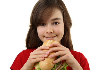 Wall Mural - Girl eating healthy sandwich isolated on white background