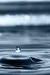 Leinwanddruck Bild Water drop and water rings