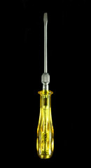 Yellow screwdriver isolated on black background