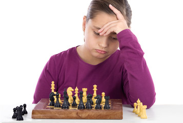 Wall Mural - Worried little girl playing chess