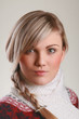 young adult with pigtail and scarf