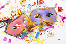 Carnival Masks And Colorful Confetti On White