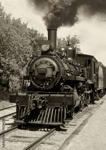 Fototapeta na wymiar Old locomotive sepia