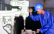 African machinist operating a drilling machine