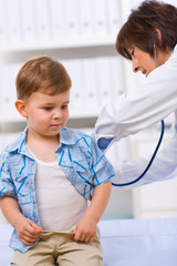 Wall Mural - Doctor examining child