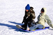 © Mehmet Dilsiz - Mother and Son Sledding down the Hill