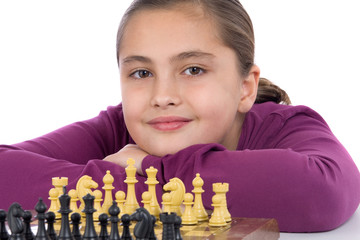 Wall Mural - Attractive little girl playing chess