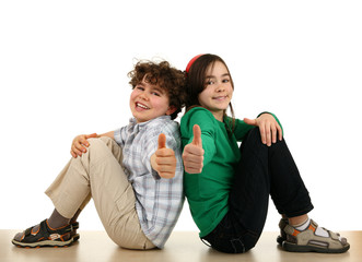 Two young happy kids showing OK sign isolated on white