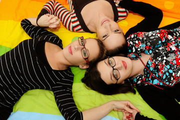 Canvas Print - three happy woman lie on floor