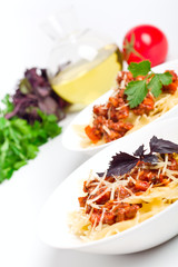 two servings of butterflies pasta with bolognese sauce