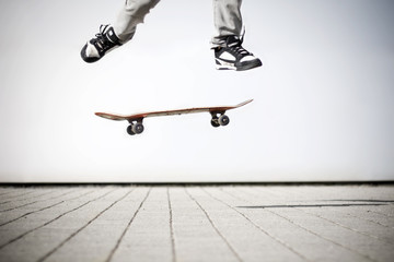 skater making an olli with his skateboard