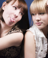 girl put out tongue pirsing to her friend
