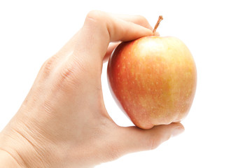 apple in hand isolated on white