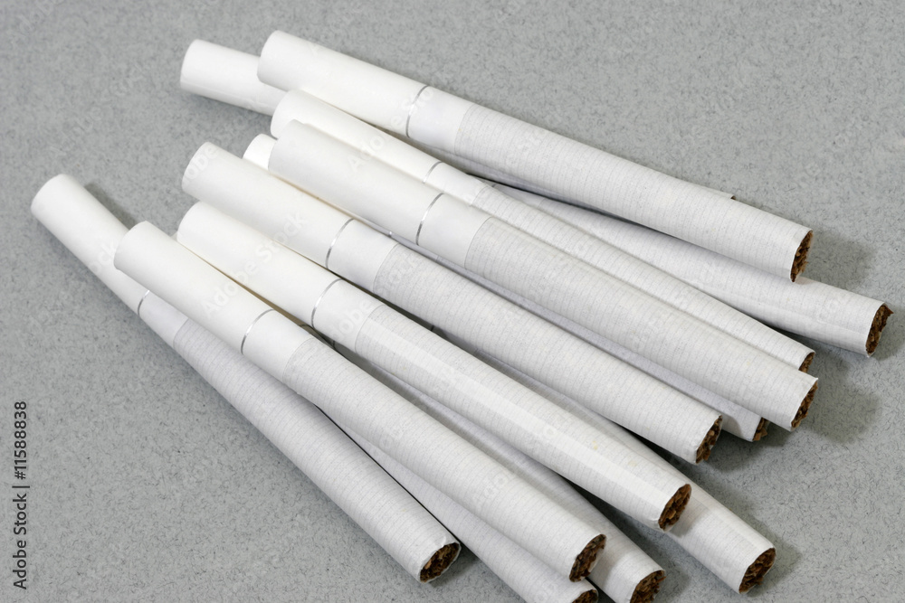 which cigarettes have white filters Cigarettes with white filters isolated on grey background Stock Photo