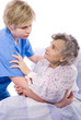 © Alexander Raths - nurse helps the senior woman get up