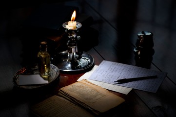 writing a letter by candlelight