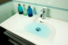 Blue Bathroom Sink With Water