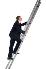 Businessman climbing ladder side view