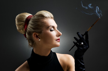 Wall Mural - Beautiful smoking woman. Retro portrait