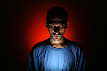 Dramatic dark portrait of young man