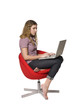 © gemenacom - Girl in a armchair with a computer