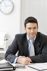 Canvas Print - Businessman working at desk