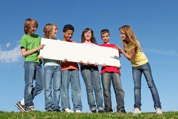 diverse group of kids, children with blank sign or banner