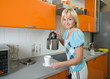 © Oleg Kozlov - young woman preparing tea