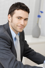 Sticker - Smiling young businessman