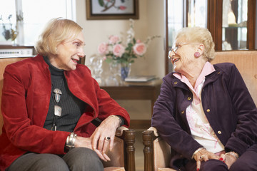 Wall Mural - Senior women relaxing in armchairs