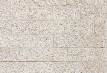 Vertical wall built of Jerusalem stone blocks