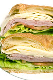 Fototapeta Kuchnia - gourmet ham swiss cheese sandwich on croissant bread