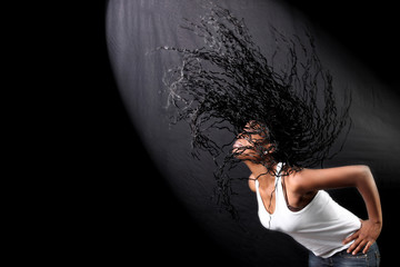 wind - lovely young afro-american woman with long flapping hairs