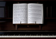 Piano And Open Sheet Music