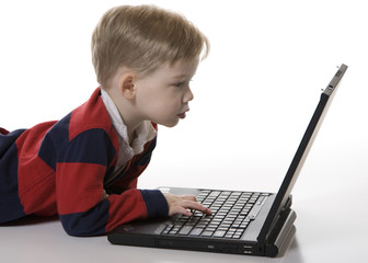 Young Boy Looking at a Laptop