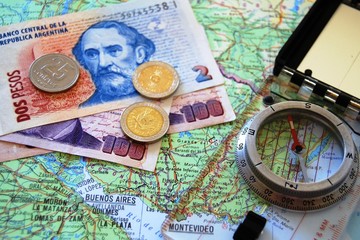 map, compass and currency
