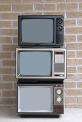 Stack of three TV sets