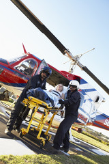 Paramedics unloading patient from Medevac