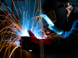 © Gordon Saunders - Welder shielding sparks from metal