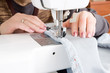 © pavel siamionov - hand sewing on a machine