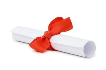 Diploma with red ribbon isolated on white