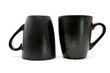 Two black coffee cups up and down isolated