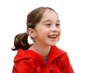 laughing seven years girl with pigtails